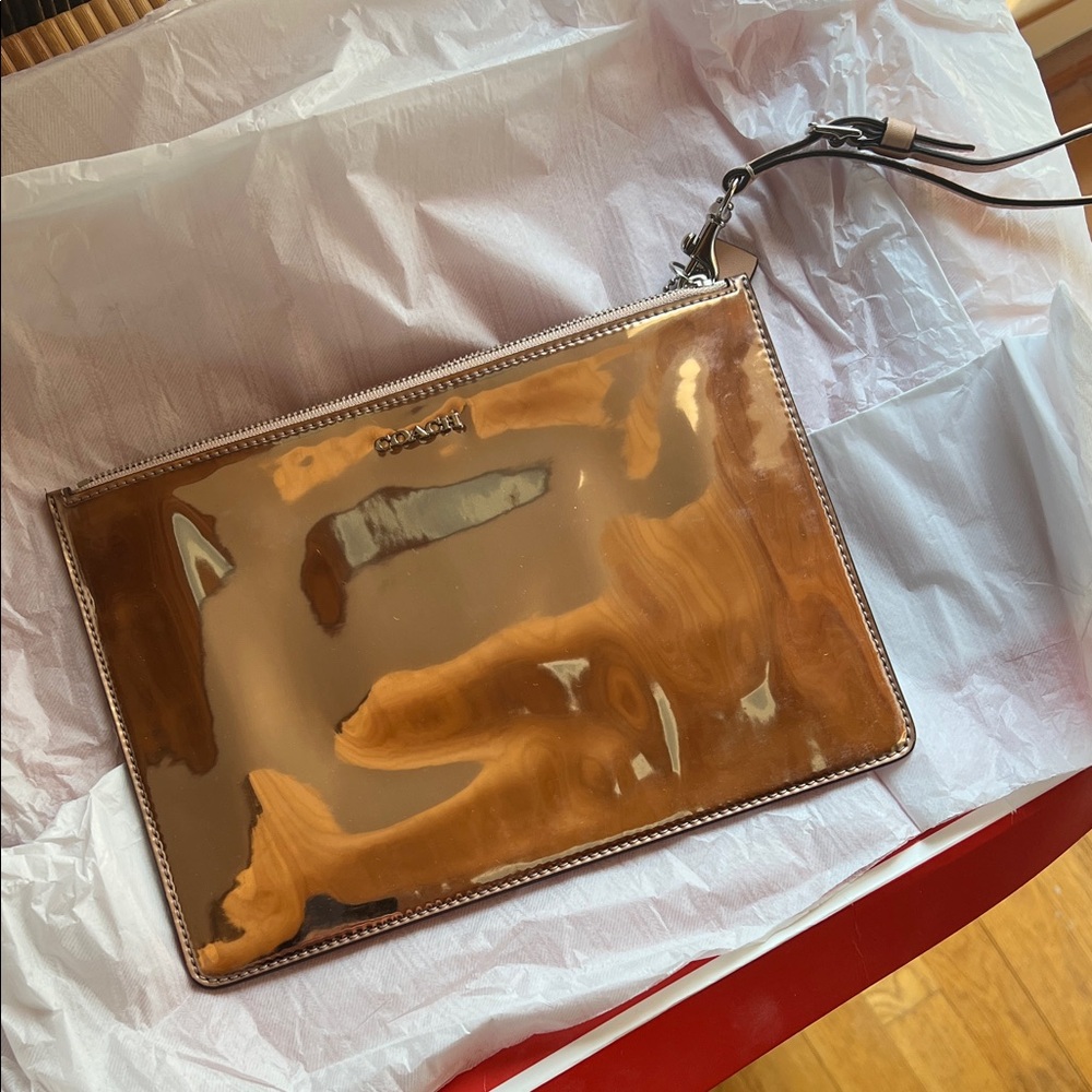 Coach Metallic rose gold  Wristlet Clutch